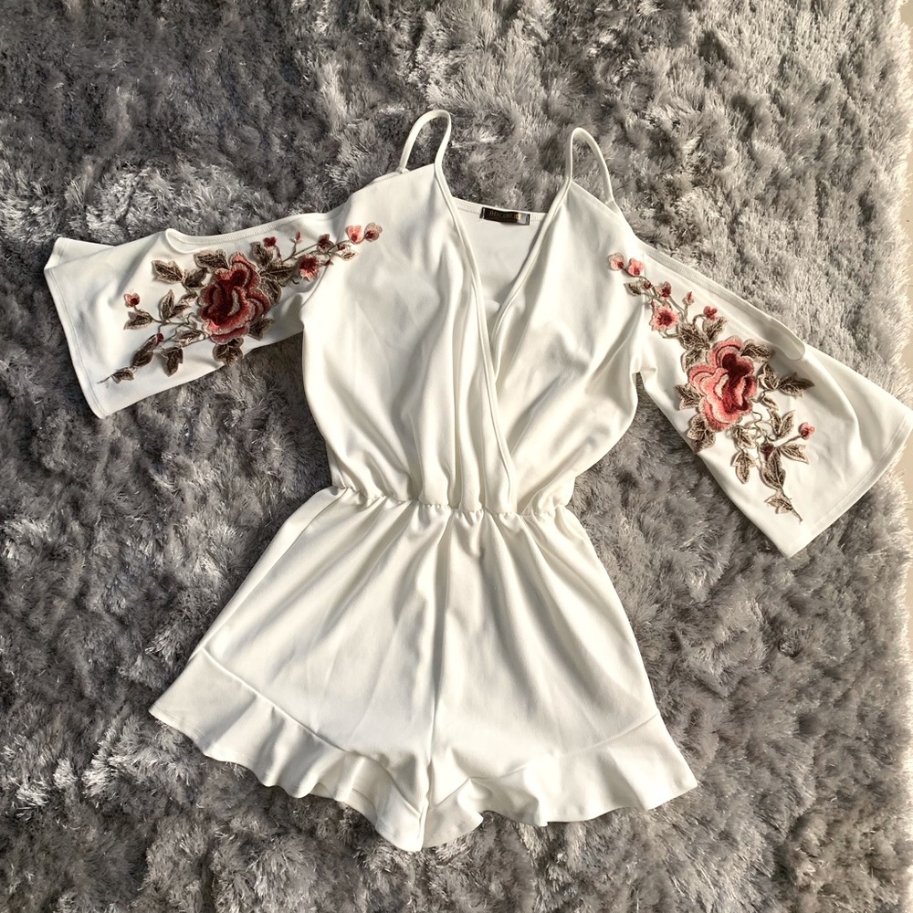 White open-shoulder romper